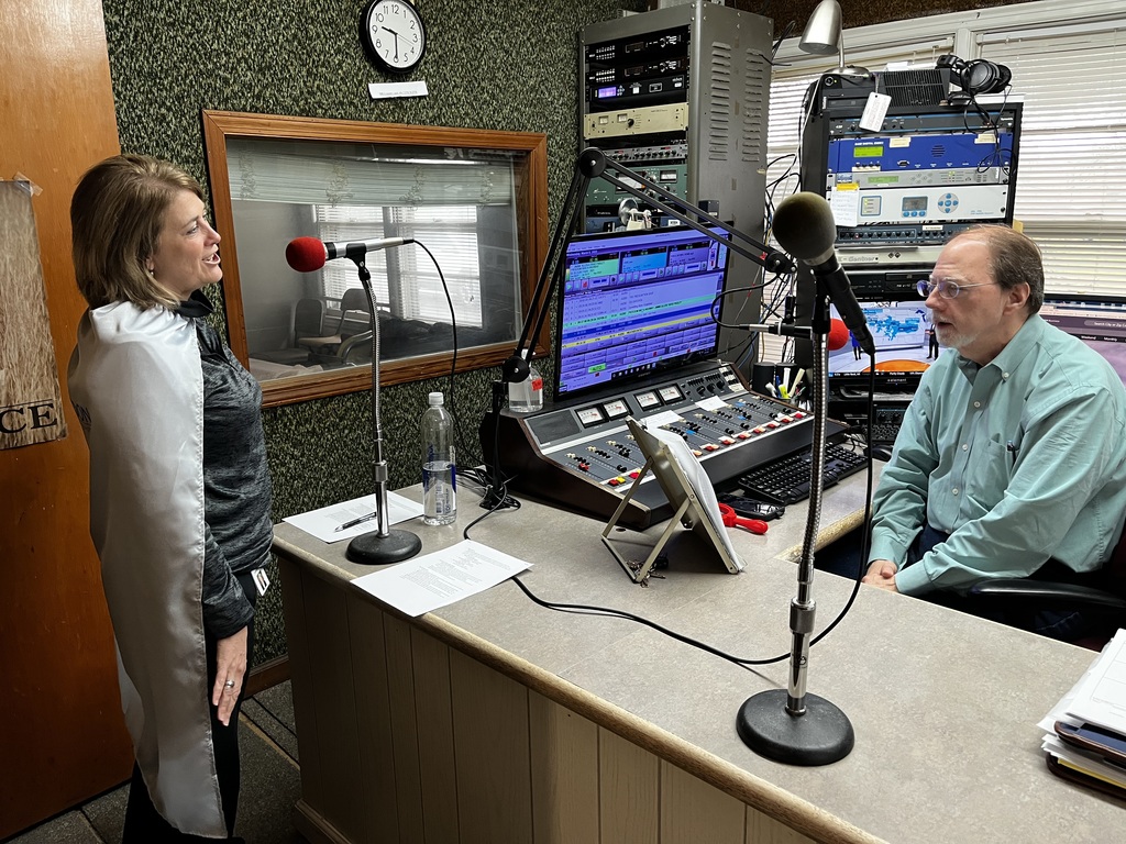 Superintendent Dr. Kimberly Fraker speaking on the radio with DJ Larry Gibson