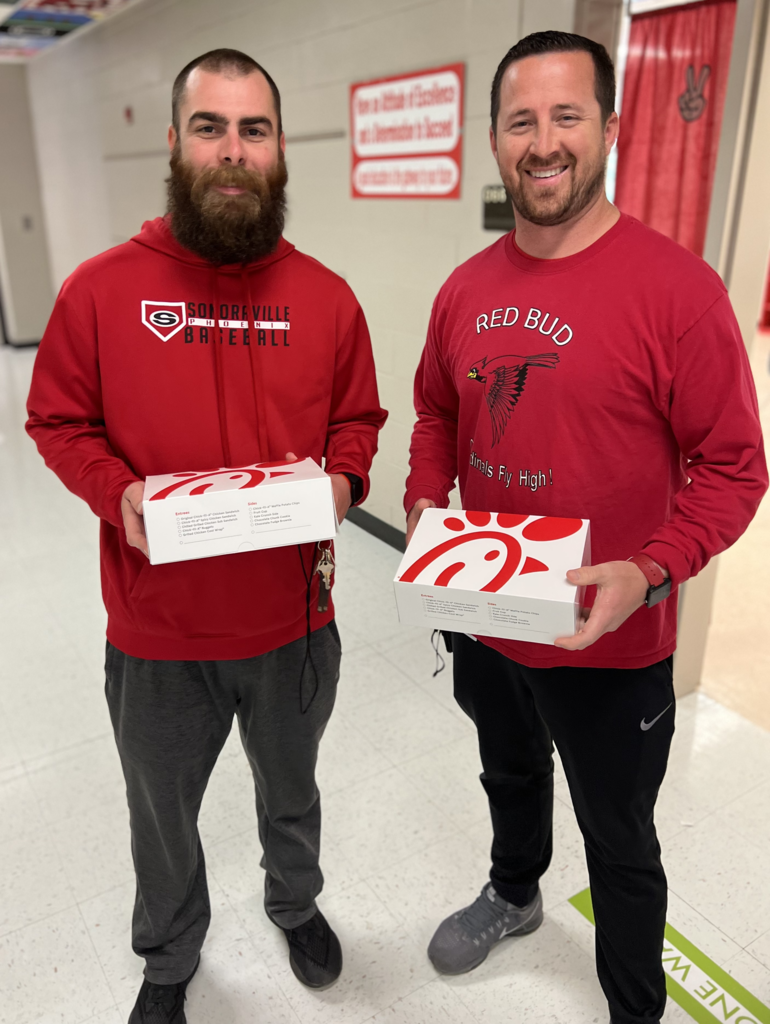 2 individuals hold Chick-Fil-A boxes