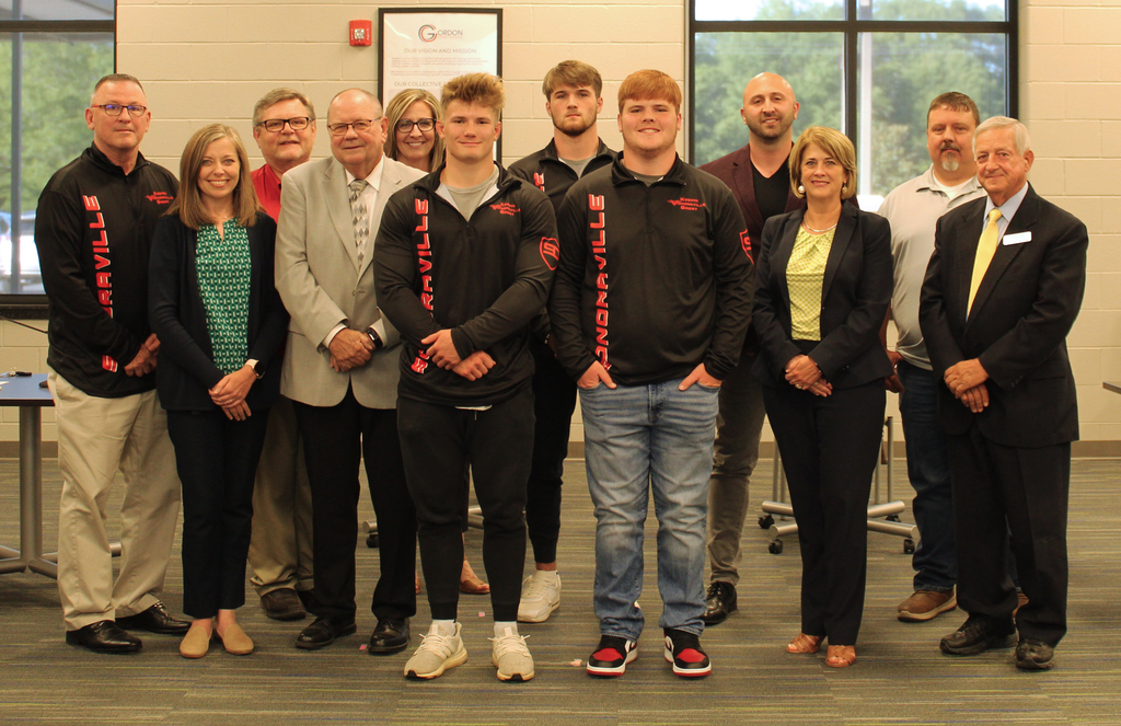 Sonoraville High School wrestling state champions stand with the Gordon County Board of Education