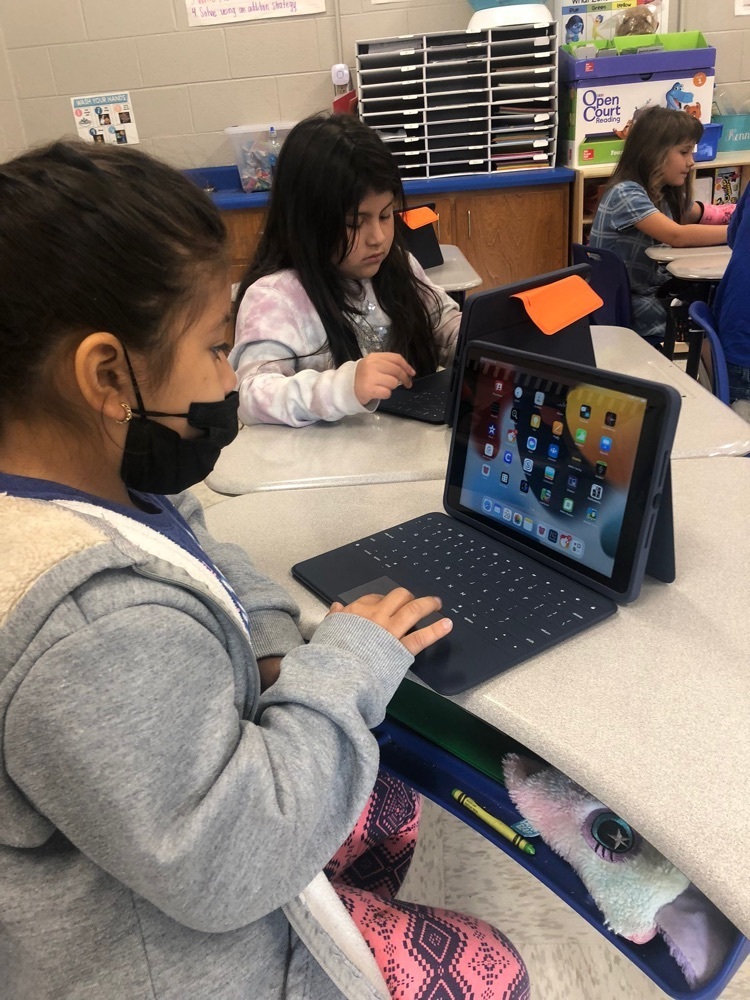 students working on iPads