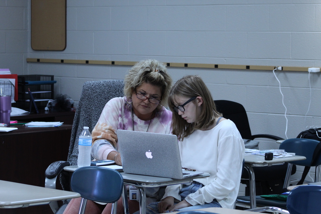 Non-Informative: Ms. Bowen works alongside a student