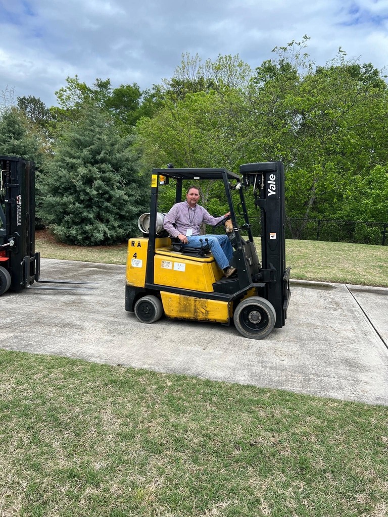 a man on a forklift