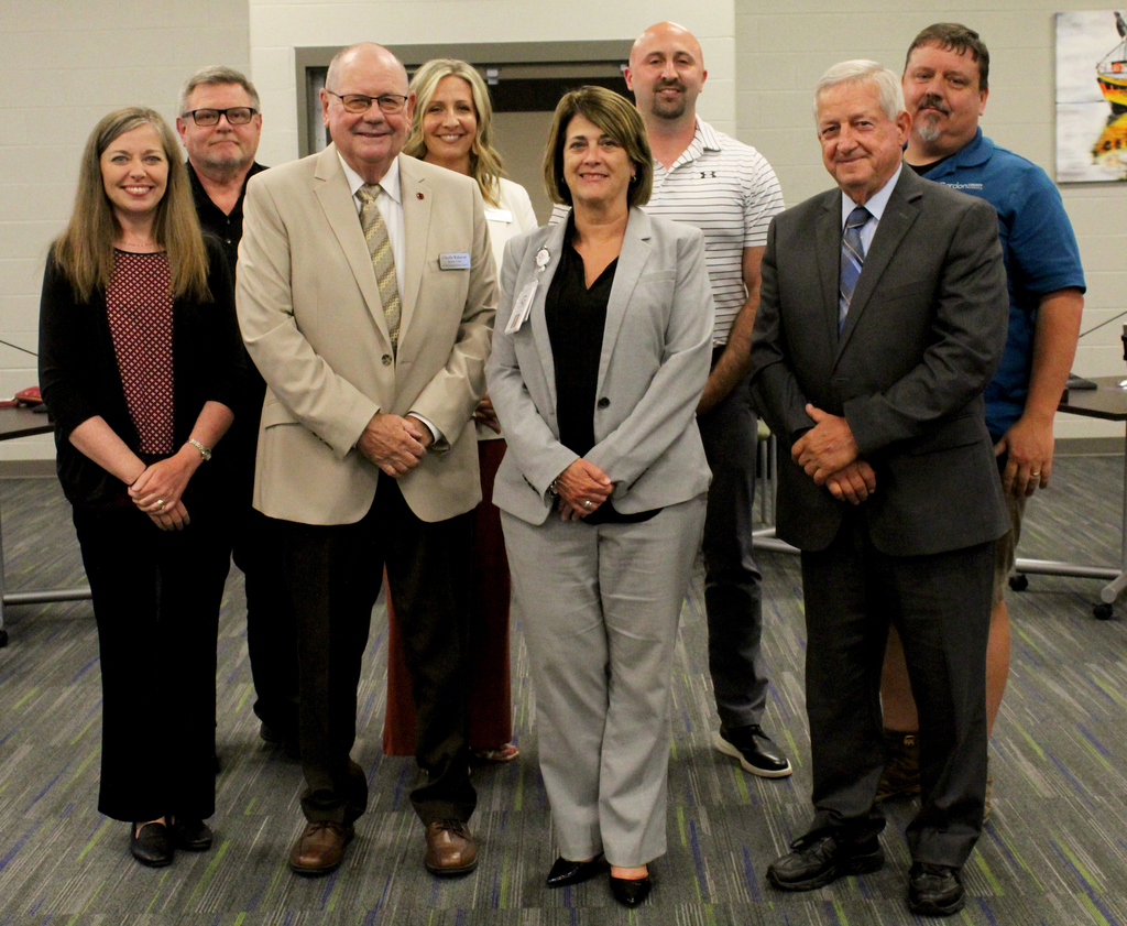 Dr. Fraker stands with the GCS Board of Education