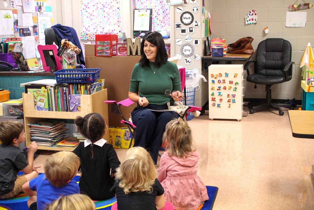 A principal reads to students
