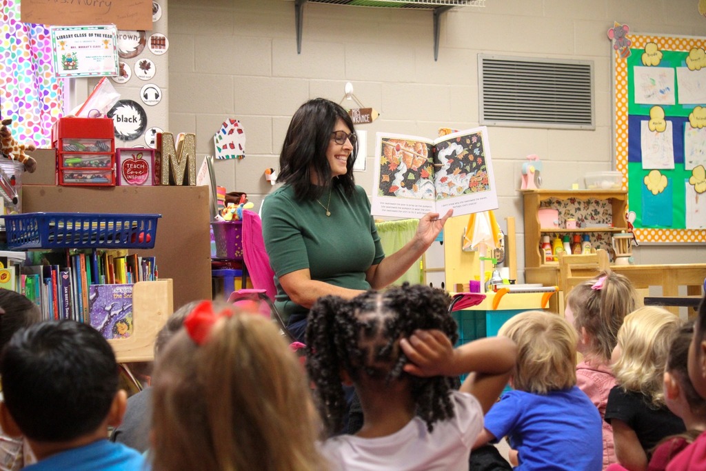 A principal reads to students